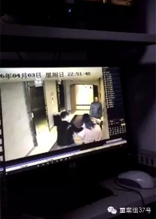 一女子在酒店被陌生男子拖拽。    視頻截圖